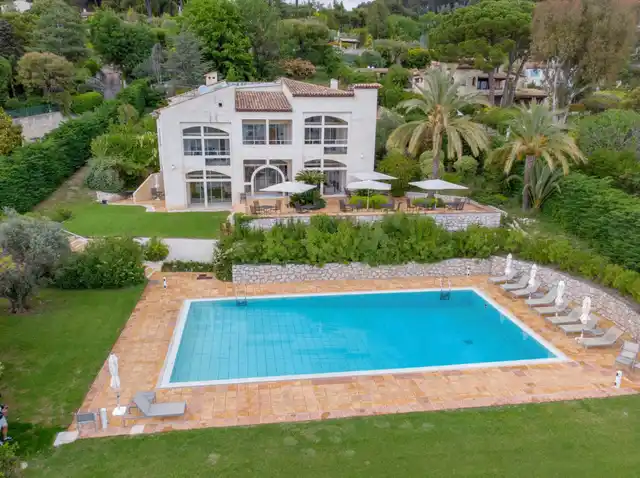 Aerial view of villa with pool and gardens